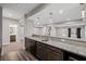 Finished basement area with a wet bar with granite countertops, cabinetry, and a sink at 5153 Elkins Ln, Acworth, GA 30101