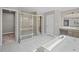 This bathroom features a glass enclosed shower, soaking tub, and dual sink vanity at 5153 Elkins Ln, Acworth, GA 30101