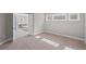 This bedroom features plush carpeting, soft natural light and an ensuite bathroom at 5153 Elkins Ln, Acworth, GA 30101