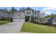 Stunning two-story home featuring a lush green lawn, a concrete driveway, and a two-car garage at 5153 Elkins Ln, Acworth, GA 30101