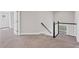 Upstairs hallway area featuring carpet flooring and view to the stairwell at 5153 Elkins Ln, Acworth, GA 30101