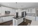 Modern kitchen featuring white cabinets, granite countertops, stainless steel appliances, and a functional center island at 5153 Elkins Ln, Acworth, GA 30101