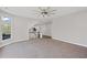 Large, carpeted living area with natural light and open access to the rest of the home at 5153 Elkins Ln, Acworth, GA 30101