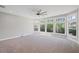 Bright, carpeted living room with multiple windows offering scenic views of the surrounding landscape at 5153 Elkins Ln, Acworth, GA 30101