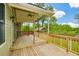 Covered wooden back deck is perfect for outdoor entertaining and relaxation at 773 Pebblebrook Rd, Mableton, GA 30126