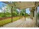 Spacious deck with wood flooring and railings overlooks the backyard, perfect for outdoor living at 773 Pebblebrook Rd, Mableton, GA 30126
