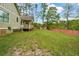 Large backyard with lush green grass and a wooded shed at 773 Pebblebrook Rd, Mableton, GA 30126