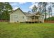 The backyard features a deck, providing an ideal spot for outdoor dining, relaxing, and entertaining guests at 773 Pebblebrook Rd, Mableton, GA 30126