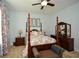 Comfortable bedroom with a four-poster bed and matching furniture at 773 Pebblebrook Rd, Mableton, GA 30126