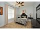 Well-lit bedroom features a large window and stylish decor with black and white accents at 773 Pebblebrook Rd, Mableton, GA 30126