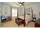 Cozy bedroom with a four-poster bed and neutral decor at 773 Pebblebrook Rd, Mableton, GA 30126