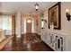 Welcoming foyer with hardwood floors, elegant lighting, and decorative console table with art at 773 Pebblebrook Rd, Mableton, GA 30126