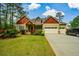 Charming home with brick and siding facade, manicured lawn, and attached garage at 773 Pebblebrook Rd, Mableton, GA 30126