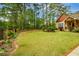 Spacious front yard with lush green grass and mature trees at 773 Pebblebrook Rd, Mableton, GA 30126