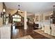 Open-concept living space with hardwood floors, vaulted ceilings, and multiple seating areas at 773 Pebblebrook Rd, Mableton, GA 30126