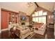 Bright living room with a stone fireplace, built-in shelves, vaulted ceilings and ample seating at 773 Pebblebrook Rd, Mableton, GA 30126