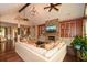 Comfortable living room featuring a stone fireplace, vaulted ceilings, and built-in shelving at 773 Pebblebrook Rd, Mableton, GA 30126