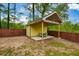 Backyard outbuilding featuring seating area on a concrete slab, perfect for entertaining and enjoying the outdoors at 773 Pebblebrook Rd, Mableton, GA 30126