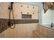 Custom tiled shower with a built-in seat and recessed niche at 773 Pebblebrook Rd, Mableton, GA 30126