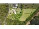 This aerial shot shows the property boundaries in yellow outlining a lush property with mature trees and lawn at 88 Cline Smith Ne Rd, Cartersville, GA 30121