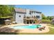 Expansive backyard features a pool, deck, patio, and lush greenery for outdoor enjoyment at 88 Cline Smith Ne Rd, Cartersville, GA 30121