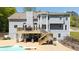 Backyard with a pool, deck, patio, staircase, mature trees and professionally landscaped yard at 88 Cline Smith Ne Rd, Cartersville, GA 30121