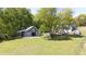Exterior view of the barn on the property, surrounded by trees and green grass at 88 Cline Smith Ne Rd, Cartersville, GA 30121