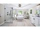 Bright bathroom featuring a large glass shower, soaking tub, and double sink vanity with modern fixtures at 88 Cline Smith Ne Rd, Cartersville, GA 30121