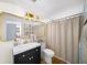 Stylish bathroom featuring a modern vanity, sleek sink, gold mirror, and tasteful decor at 88 Cline Smith Ne Rd, Cartersville, GA 30121