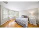 Bedroom features hardwood floors, light colored walls and trim, and an ensuite area with a desk and a mirror at 88 Cline Smith Ne Rd, Cartersville, GA 30121