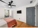 Comfortable bedroom with hardwood floors, ceiling fan, and adjacent sitting area at 88 Cline Smith Ne Rd, Cartersville, GA 30121