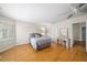 Bedroom with hardwood floors, shutters, and an ensuite area with a desk and a mirror at 88 Cline Smith Ne Rd, Cartersville, GA 30121