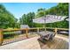 Outdoor deck includes a table and umbrella offering a great space to relax and enjoy nature views at 88 Cline Smith Ne Rd, Cartersville, GA 30121