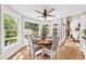 Cozy dining area featuring bay windows that flood the space with natural light, and a round wood table at 88 Cline Smith Ne Rd, Cartersville, GA 30121