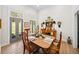 Dining room showcases wood floors and a view to outdoor greenery with an antique wooden table at 88 Cline Smith Ne Rd, Cartersville, GA 30121