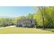 Picturesque home nestled in a lush landscape, featuring a sprawling lawn and elegant architecture at 88 Cline Smith Ne Rd, Cartersville, GA 30121
