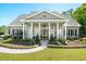 Charming home featuring a grand front porch with stately columns and manicured landscaping at 88 Cline Smith Ne Rd, Cartersville, GA 30121