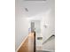 Hallway with hardwood floors and neutral walls leading to the bedrooms at 88 Cline Smith Ne Rd, Cartersville, GA 30121