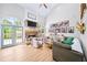 Bright living room with a stone fireplace, vaulted ceiling and large windows bringing the outdoors in at 88 Cline Smith Ne Rd, Cartersville, GA 30121