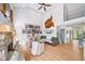 Bright living room with a stone fireplace, vaulted ceiling and large windows bringing the outdoors in at 88 Cline Smith Ne Rd, Cartersville, GA 30121