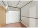 Storage area with block wall, hanging pipes and rods with wood paneling at 1788 Hammond Woods Sw Cir, Marietta, GA 30008