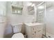 Clean bathroom featuring a shower stall, toilet, sink and cabinet, and simple decor at 1788 Hammond Woods Sw Cir, Marietta, GA 30008