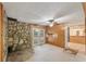 Bonus room with stone accent wall, light fixture and french doors to the outside at 1788 Hammond Woods Sw Cir, Marietta, GA 30008