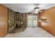 Unique bonus room with a stone wall, wood paneling, and french doors at 1788 Hammond Woods Sw Cir, Marietta, GA 30008