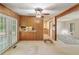 Bonus room showcasing a stone wall, built-in storage and french doors leading to the yard at 1788 Hammond Woods Sw Cir, Marietta, GA 30008