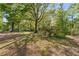 Lawn and mature trees in the front yard provide shade for this home at 1788 Hammond Woods Sw Cir, Marietta, GA 30008