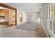 Bright living room with carpet, a large rug, and multiple windows providing natural light at 1788 Hammond Woods Sw Cir, Marietta, GA 30008
