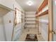 Walk-in pantry with adjustable shelves and tile flooring at 1788 Hammond Woods Sw Cir, Marietta, GA 30008