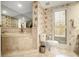 Bathroom showcases a bathtub with tile surround, toilet, and window for natural light, providing a serene atmosphere at 2769 Peachtree Ne Rd # 6, Atlanta, GA 30305