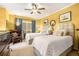 Bright bedroom showcasing two beds, a ceiling fan, and a comfortable chair, offering a relaxing retreat at 2769 Peachtree Ne Rd # 6, Atlanta, GA 30305